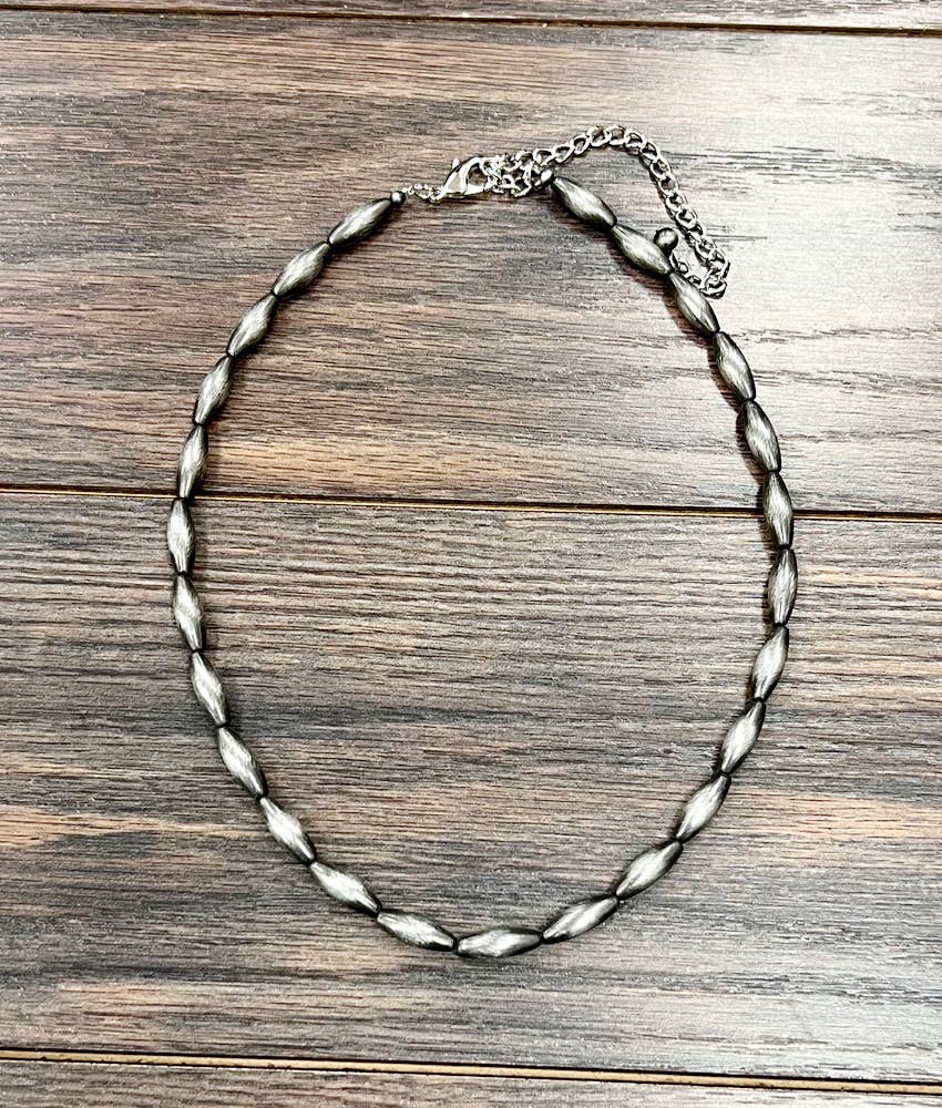 739531, 18" 18mm Elongated Navajo Bead Necklace
