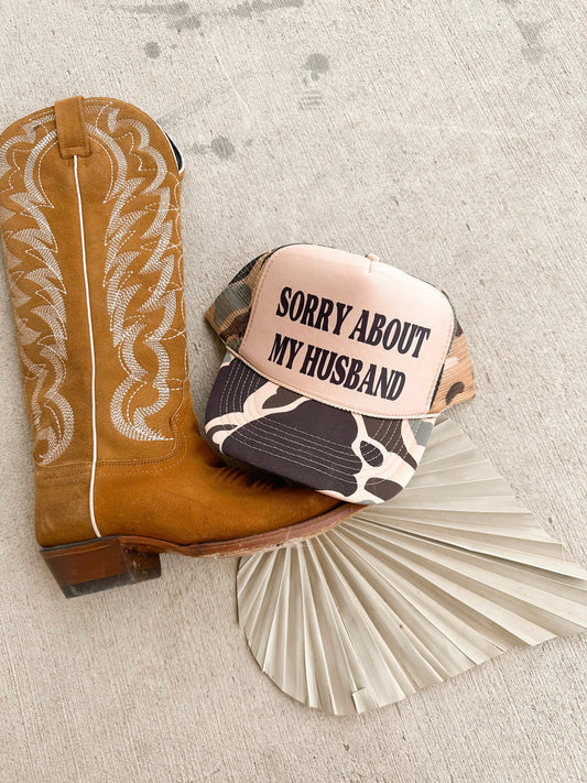 SORRY ABOUT MY HUSBAND CAMO TRUCKER HAT